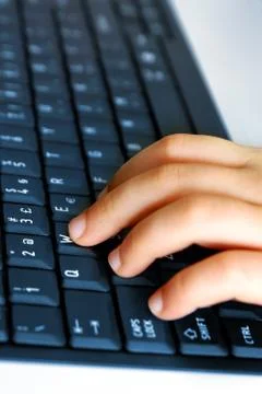 Hand on keybord Stock Photos