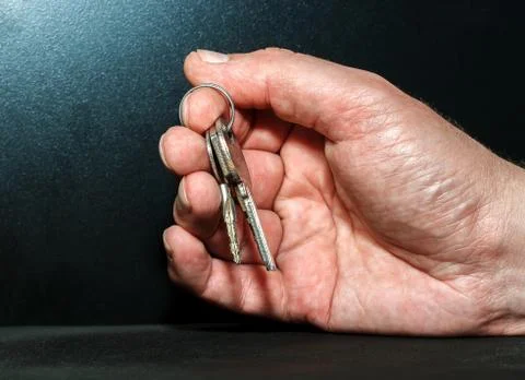 Hand with keys Stock Photos