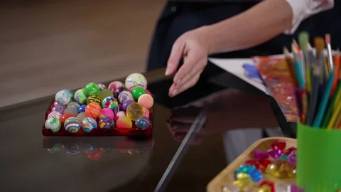 Hand of kid choosing colored ball at therapist Stock Footage 190979429