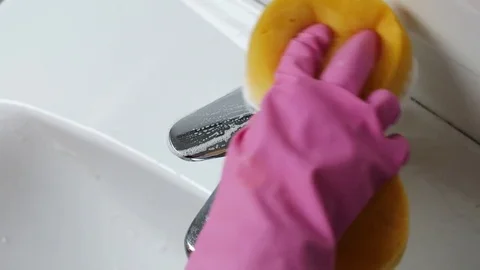 Hand in kitchen glows cleaning a bathroom tap Stock Footage 72787082