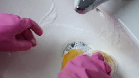 Hand in kitchen glows cleaning a bathroom sink Stock Footage 72787245