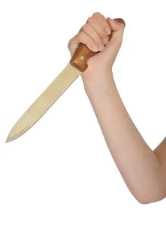 Hand with a kitchen knife Stock Photos