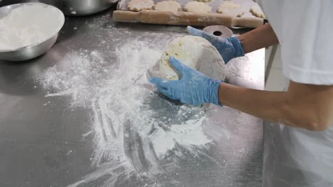 Hand Kneading and Rolling Dough in Professional Kitchen Stock Footage 321415080