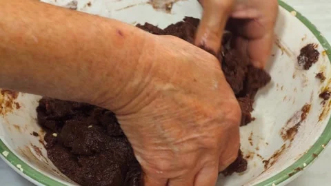 Hand-kneading the cocoa dough until smooth and even Stock Footage 320067965
