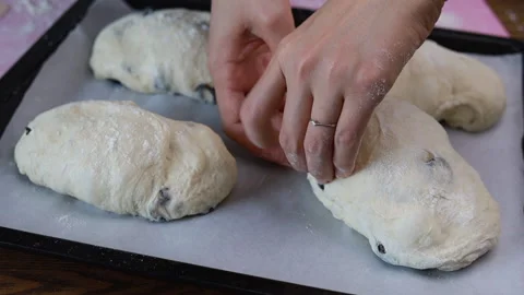 Hand kneading dough and placing dough on a baking tray Stock Footage 160147718