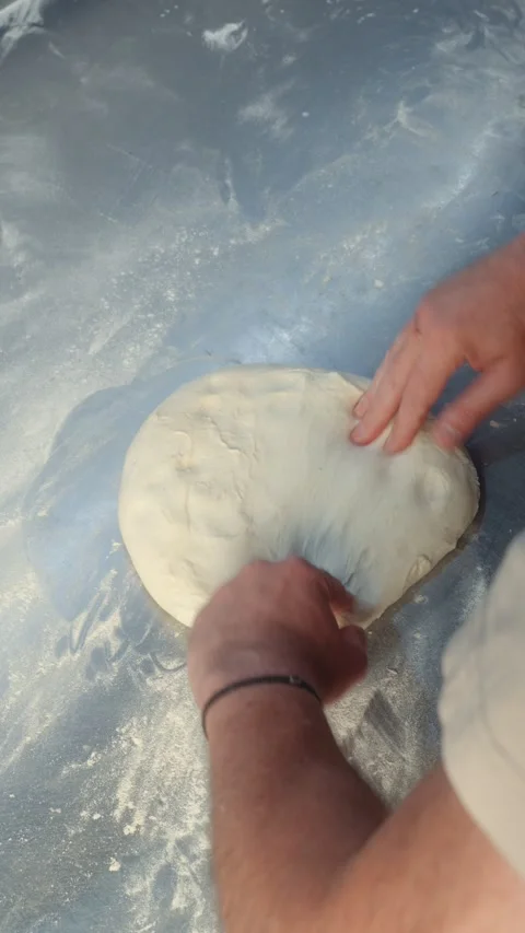 Hand Kneading Dough on Floured Work Surface Top View Stock Footage 344393164
