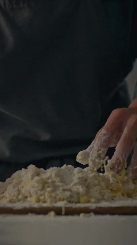 Hand kneading dough for homemade bread in a cozy kitchen environment Stock Footage 331594959