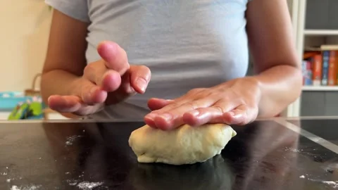 Hand kneading dough on table to prepare staple food Stock Footage 281340048