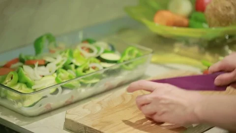 Hand with a knife cut vegetables for frying Stock Footage 69998314