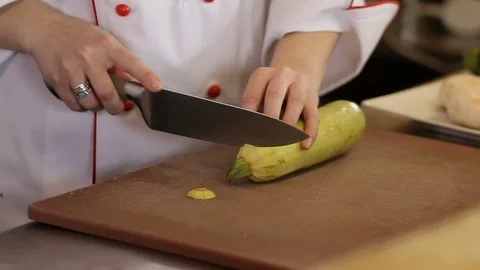 Hand with a knife cut vegetables for frying Stock Footage 74716084