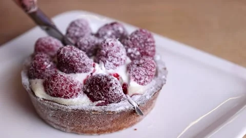 A hand with a knife cuts dessert Stock Footage 168341953