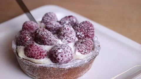 A hand with a knife cuts dessert Stock Footage 168341956