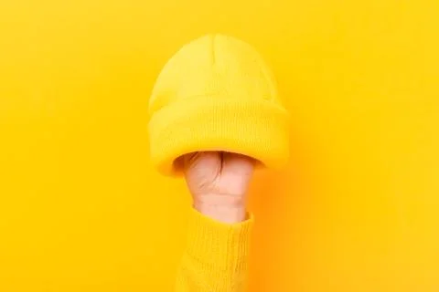 Hand with knitted wool hat Stock Photos