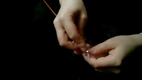Hand knitting in low light Stock Footage 72915756