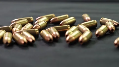 A hand knocks down several cartridges placed neatly Stock Footage 281105840