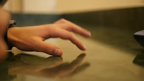 Hand knocks his fingers on the table in slow motion Stock Footage 102778487