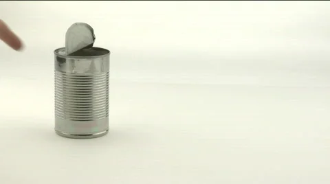 A hand knocks over an open tin can full of beans. Vidéo 557782