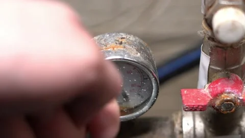 The hand knocks on the water pressure sensor. Breakdown of the water pressure Stock Footage 153663379