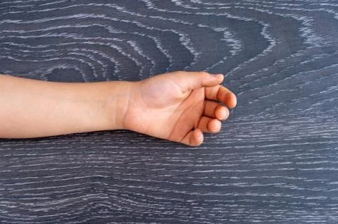Hand on a laminate background Stock Photos