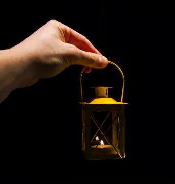 Hand with lantern Stock Photos