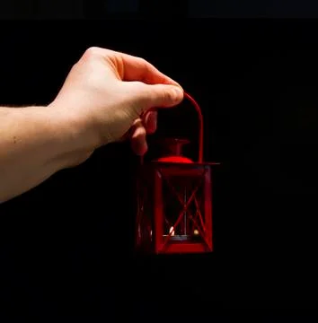 Hand with lantern Stock Photos
