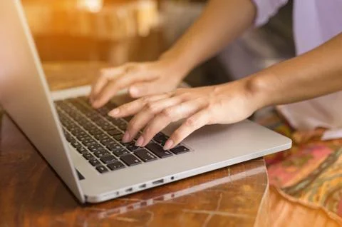Hand on laptop. Stock Photos