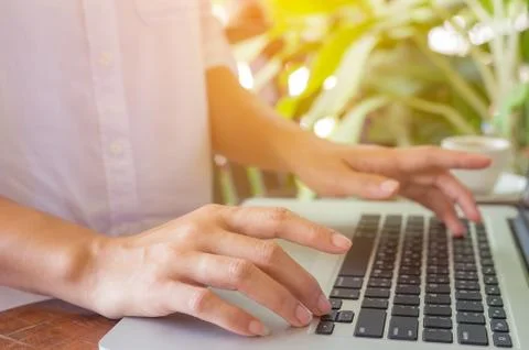 Hand on laptop. Stock Photos