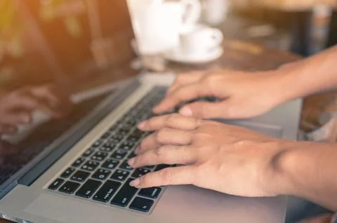 Hand on laptop. Stock Photos