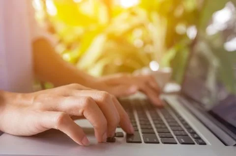 Hand on laptop. Stock Photos