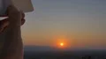 The hand launch paper airplane on sunset background. slow motion capture 4k or 4k+ Resolution