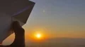 The hand launch paper airplane on sunset background. slow motion capture 4k or 4k+ Resolution