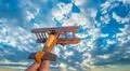 The hand launch wooden plane on the background of a blue sky Photo