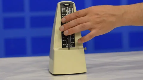 Hand launched metronome Stock Footage 39740773