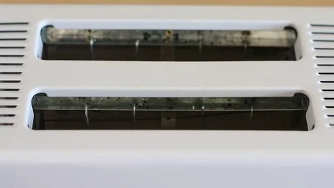 Hand laying pieces of bread in toaster Stock Footage 84656484