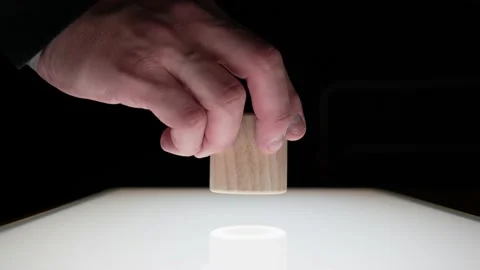 Hand lays down cube and barrel in a Space Odyssey look Stock Footage 171298875