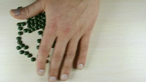 Hand lays out of colored tablets symbol Yin Yang Stock-Footage 119517938