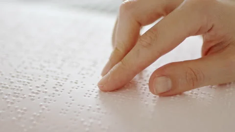 Hand learning Braille book with finger. Vídeo Stock 213343767