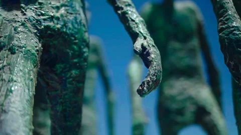 Hand-level close-up of memorial sculpture Vídeos de archivo 337874740
