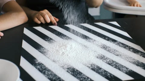 Hand leveling flour on kitchen surface Stock Footage 321954143
