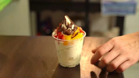 Hand lif take ice cream fruits natura chocolate in slow motion berries Stock Footage 209424864