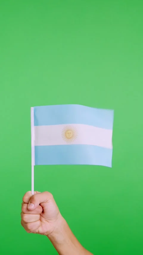 Hand lifting a argentine pennant while waving by the wind Stock Footage 253845287