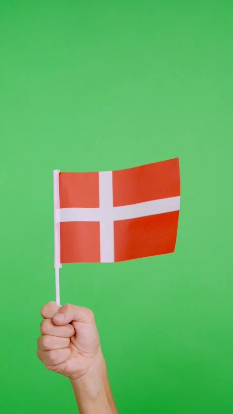 Hand lifting a danish pennant while waving by the wind Video stock 254941534