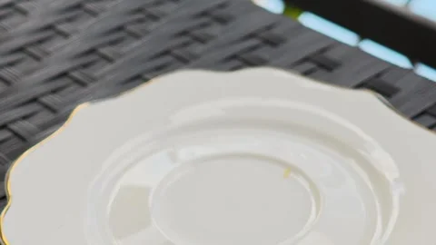Hand lifting elegant white coffee cup filled with dark coffee Vidéo 310250818