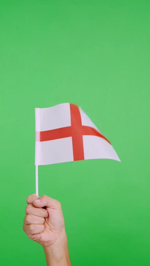 Hand lifting a english pennant while waving by the wind Stock Footage 254330719
