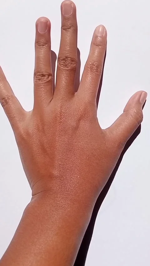 Hand lifting fingers one by one for counting or gesturing. Stock Footage 313728851