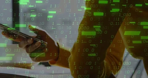 Hand lifting smartphone at desk as binary code floating on screen, thumb tapping Stock Footage 328010930