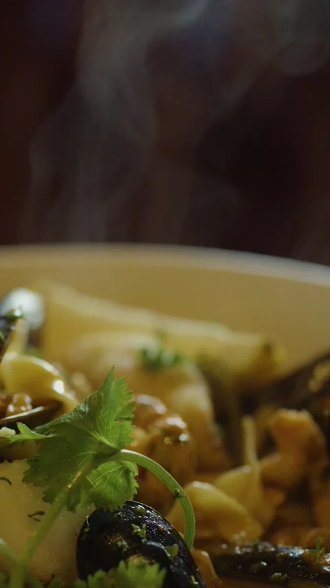 Hand Lifting Steaming Seafood Chowder With Spoon Stock Footage 314706675