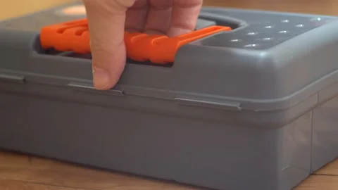 Hand lifts the container from the floor Stock Footage 139689145