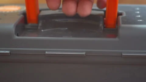 Hand lifts the container by the handle Stock Footage 139689061