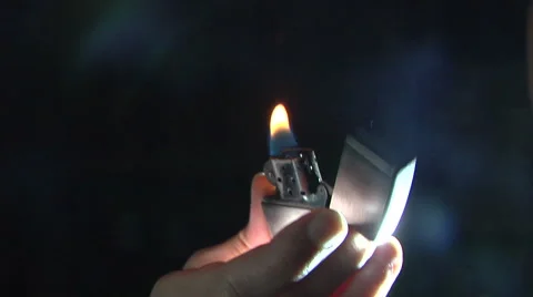 Hand with lighter igniting sparks HD Stock Footage 51866897
